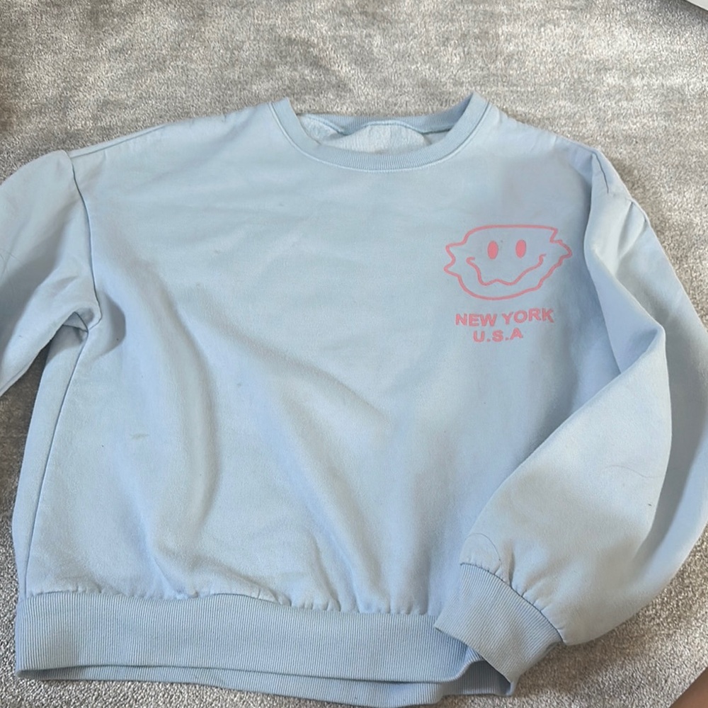 Light Blue Sweatshirt with Pink Graphic